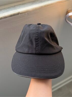 Black baseball cap with adjustable strap